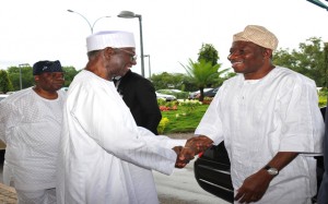 PIC 10. PRESIDENT GOODLUCK JONATHAN (R) IN A HANDSHAKE WITH THE CHAIRMAN OF PDP BOT, CHIEF TONY ANENIH AT THE NNAMDI AZIKIWE INTERNATIONAL AIRPORT ON SATURDAY (20/9/14)