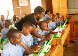 Firm, foundation support teachers with computer education, laptops
