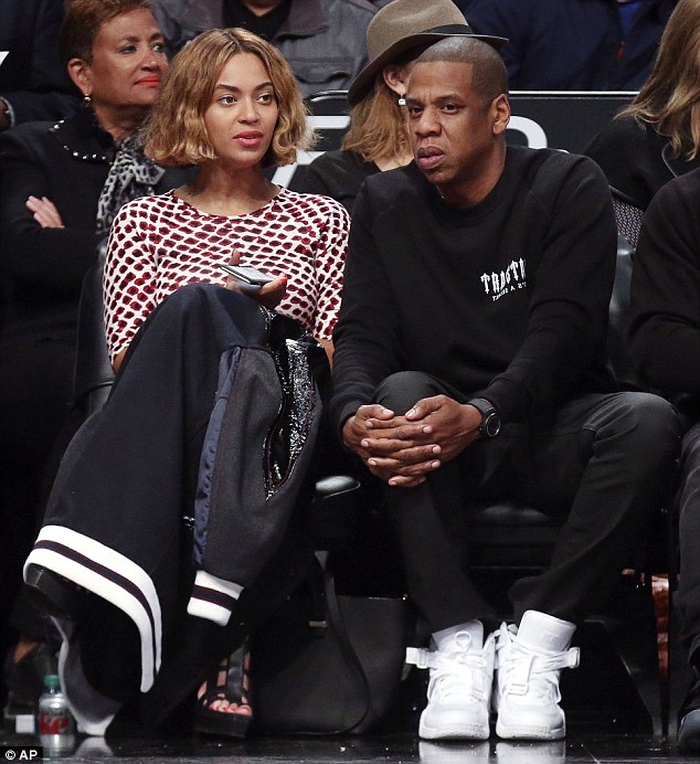 Beyonce  sitting courtside with Jay Z at the Brooklyn Nets game