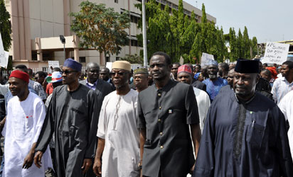 Buhari, Amaechi, others lead APC members on protest match in Abuja