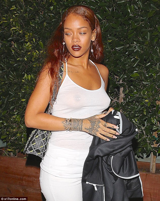 Rihanna goes braless in see-through top