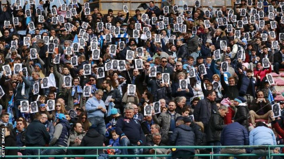 Napoli fans wear Kalidou Koulibaly masks in protest against racism