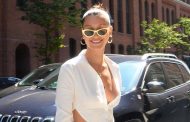 Bella Hadid gets heads turning in belly-baring, backless peak '90s fashion outfit
