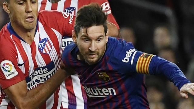 Messi sets new Liga landmark as Barca down Atletico in top of table clash