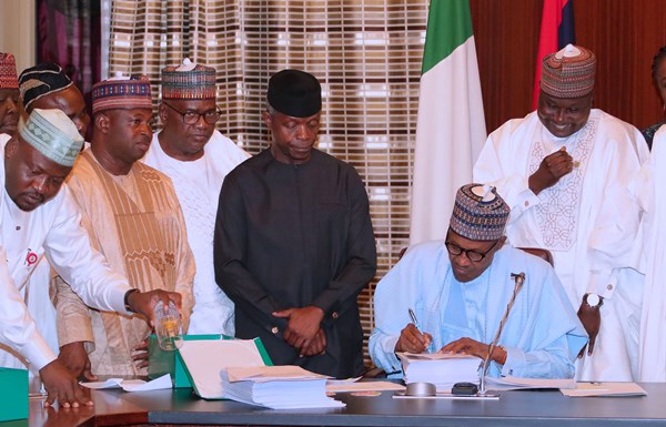 Buhari signs 2019 Appropriation bill of N8.92trillion into law