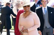 Oprah Winfrey walks one of her former students down the aisle