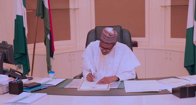 Buhari signs COVID-19 regulations 2020