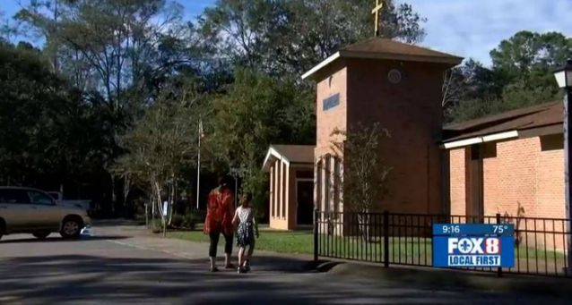 Church burns altar where priest had sex with two women, Louisiana archbisohp says