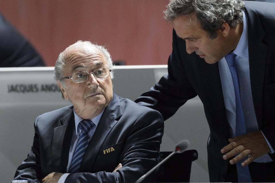 Blatter, Platini vow to fight eight-year bans in courts