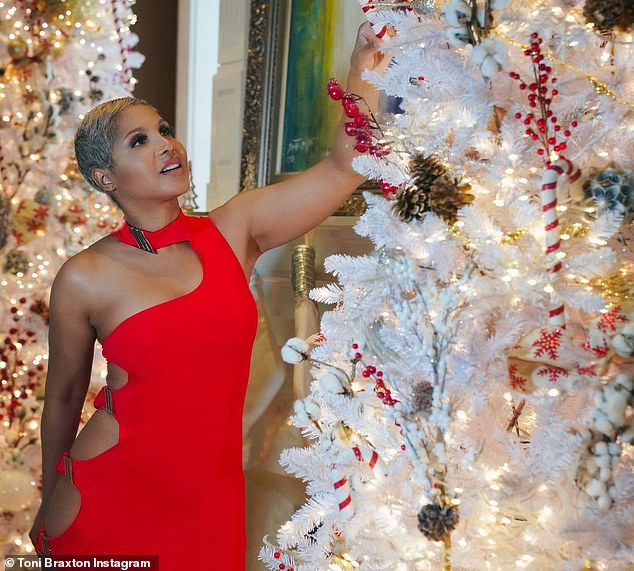 Toni Braxton, 53, looks stunning in revealing red holiday dress: 'The sexiest woman alive'