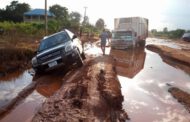 Youths make living from stuck vehicles on collapsed Enugu-Onitsha expressway