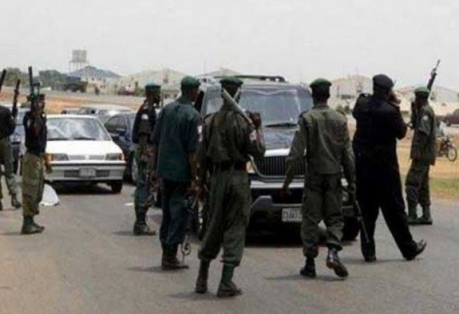 Policemen at check point assault, threaten to shoot lawyer